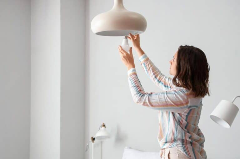 Woman Changing Light To An LED