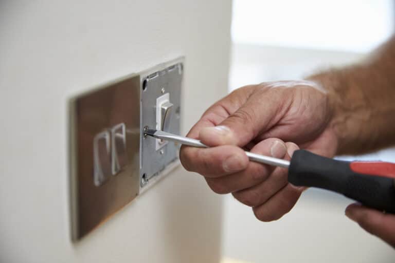 A Residential Electrician At Work